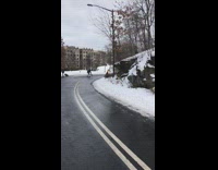 guy in yellow sweater dances on street 