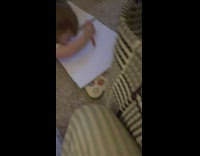 Baby hits notebook before drawing 
