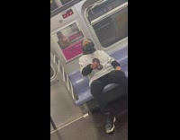 Black headphones guy plays air drums subway 