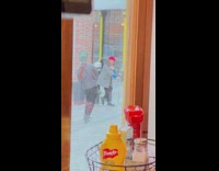 Woman in red beret with an umbrella on the sidewalk