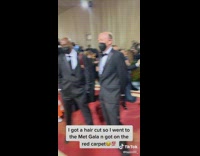 Guy recording himself walking on red carpet