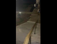 Girl slides down side of stairs falls off