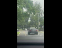 Black car big wheels extend on side