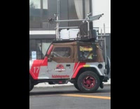 Man rap sing inside Jurassic Park jeep