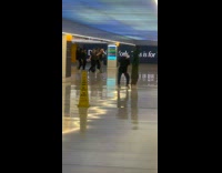 Collab WINY - Two Groups of Teens Records Themselves Dance on a hallway at a train station 