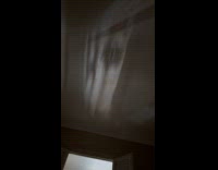 Cars on street reflection on the wall