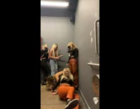 Two women fall and accidentally kick people while attempt handstand