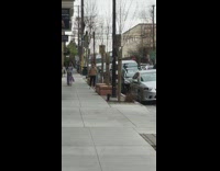 Girl poses for photos outside stores 