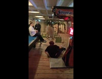 Guy kicks punching machine get high score