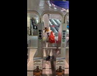 Man long white top hat pass through turnstile