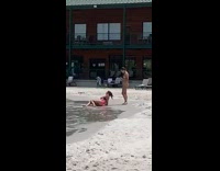 Black pink bikini girl crawls lays back 