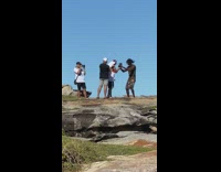 Man sleeveless top head bang camera crew