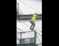 Construction worker twerking on scaffolding
