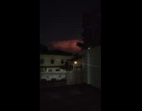Orange cloud with lightning in the sky