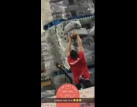 Red shirt guy knocks down packages pallet 