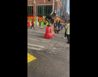 Guy girl stand orange traffic barrier protest 