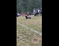 Kid tries to block other football player fail  