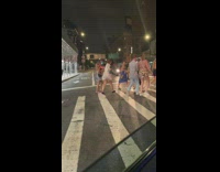 2 ladies cross street with no shoes on 