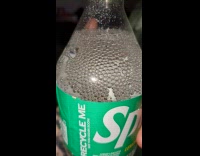 Bubbles pile up in Sprite plastic bottle