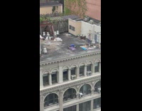 Man Does Push Ups on Structure Rooftop