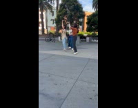 Three women tiktok dance outside Whole Foods