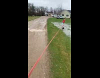 Man Rides on Grass and Water with Snowboard