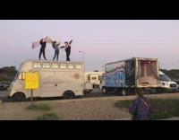 Three girls white van roof scarf concert 