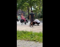 Woman pink leggings ride stationary bike street