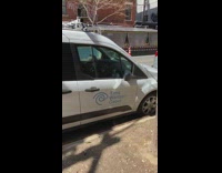 Tims Warmer Cabel white van parked outside