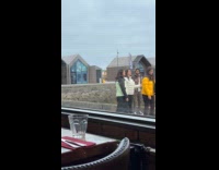 Group tiktok dance outside Old Harbor restaurant
