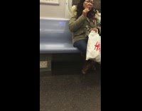 (DUPLICATE) woman plucks hair from chin on subway 