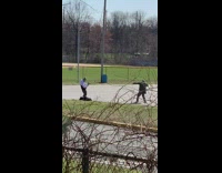 Two guys parking lot white jacket 