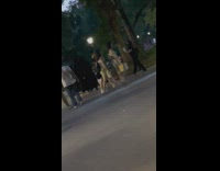 Lots of people walk in black robes