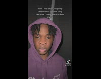 Braided Man with Big Nostrils Leans Back