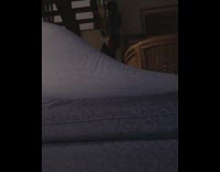 Kitten tries to knock candle off table 