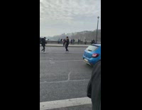 Man yellow sweater music video busy road