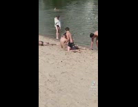 Young boy put sand inside underwear  beach