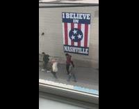 Four people dance Nashville flag mural background