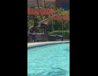 Woman black swimsuit dance face mask pool