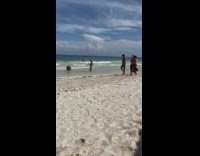 Woman in bikini dips hair for a hairflip