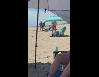 Bikini girl tiktok dance blue umbrella sand 