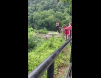 Woman black jogging pants hand stand park