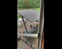 Parents outside swing chair dance together 