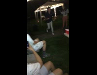 Guy jumps over beer pong table and falls on the ground