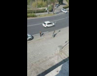 Girl black pants pose around pole street