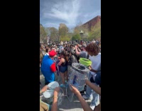 Crowd at park using makeshift helment bong
