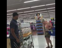 Guy pranks woman looking at cloth textiles, stutters and meows