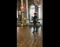 Woman in black outfit poses inside the museum