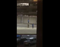 Boys taking photos in parking garage