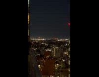 Fireworks explode on the rooftop of building